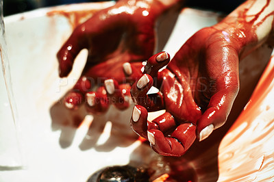 Buy stock photo A cropped shot of a woman washing blood from her hands in a basin