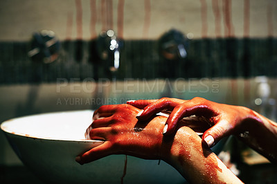 Buy stock photo A cropped shot of a woman washing blood from her hands in a basin