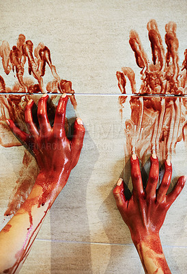 Buy stock photo A cropped shot of a woman's bloody hands on a bathroom wall