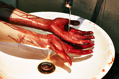 Buy stock photo A cropped shot of a woman washing blood from her hands in a basin