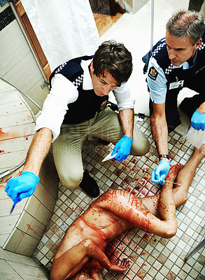 Buy stock photo Shot of investigators working their way through a bloody crime scene