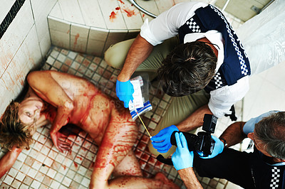 Buy stock photo Shot of investigators working their way through a bloody crime scene