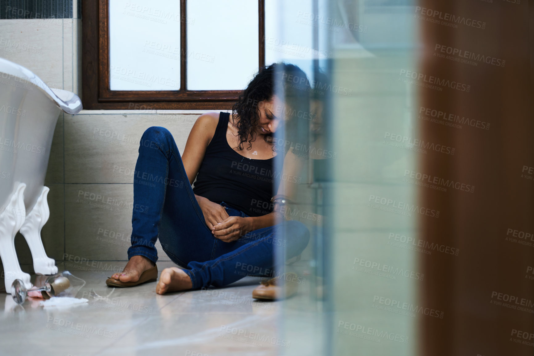 Buy stock photo Woman, drug addict and sleep in bathroom for addiction or withdrawal symptoms, depression and mental health. Person or user, overdose and glass of alcoholic for substance abuse for feeling of stress.