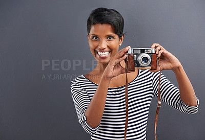 Buy stock photo Woman, smile and portrait with camera for picture, photographer and lens in studio for capture on mockup. Indian person and happy for retro, vintage and shot for pose, angle and zoom indoor  