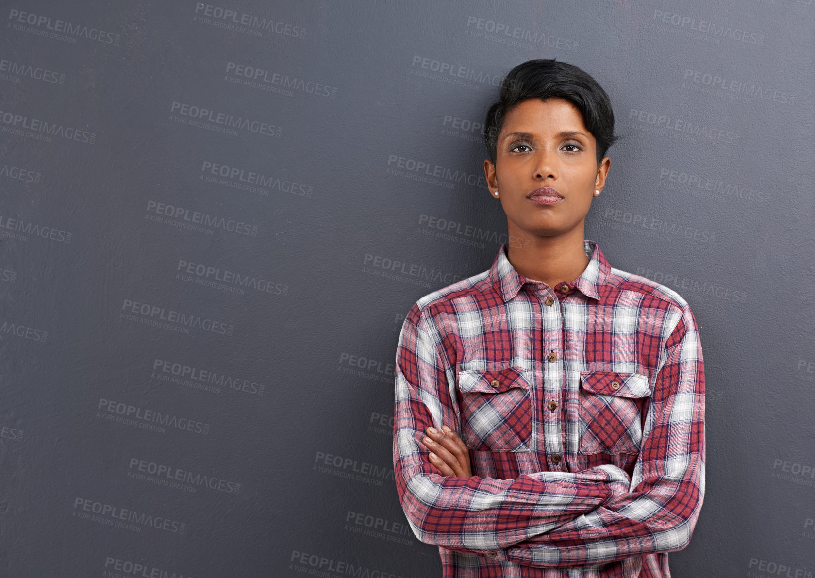 Buy stock photo Studio shot of a beautiful young woman against a grey background