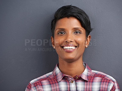 Buy stock photo Happy, portrait and Indian person with smile with gray background at a creative agency office. Hipster, confidence and employee with modern and casual clothing with worker fashion of a professional