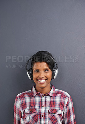 Buy stock photo Headphone, woman and portrait for gadget, audiobook and sound for listen or hear for podcast. Young person and smile in studio for radio, streaming and waves for volume, loud and speaker for track  