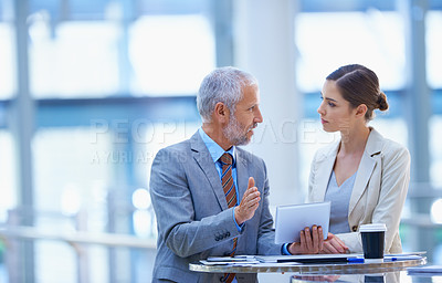 Buy stock photo Businesspeople, colleagues and talking with tablet, conversation and discussion for workshop. Chat, hand gesture and coworkers for conference, professional and corporate male manager with employee
