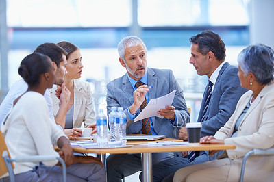 Buy stock photo A cropped shot of a diverse group of businesspeople having a meeting
