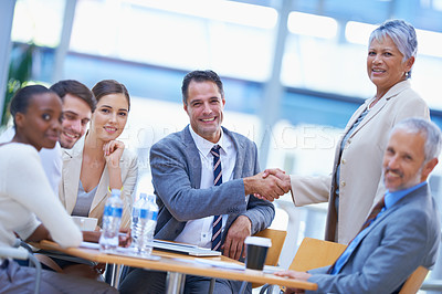 Buy stock photo Colleagues, office and handshake with smile for success on deal, contract and teamwork. Portrait, diverse and boardroom with happiness for business achievement with congratulations as ceo of company