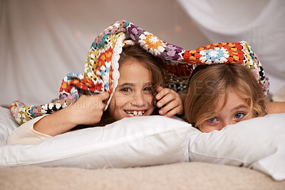 Buy stock photo Shot of two cute little girls having a sleepover