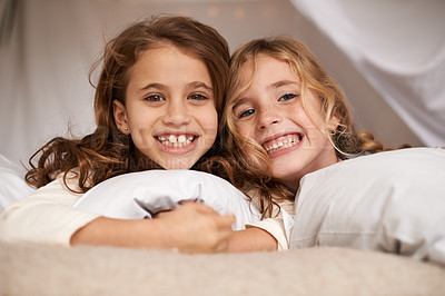 Buy stock photo Excited, sleepover and portrait of children in bedroom for playing, bonding and relax with toys in home. Happy, friends and young girls on bed in tent or blanket fort for childhood, fun and happiness