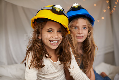 Buy stock photo Shot of two cute little girls having fun during a sleepover