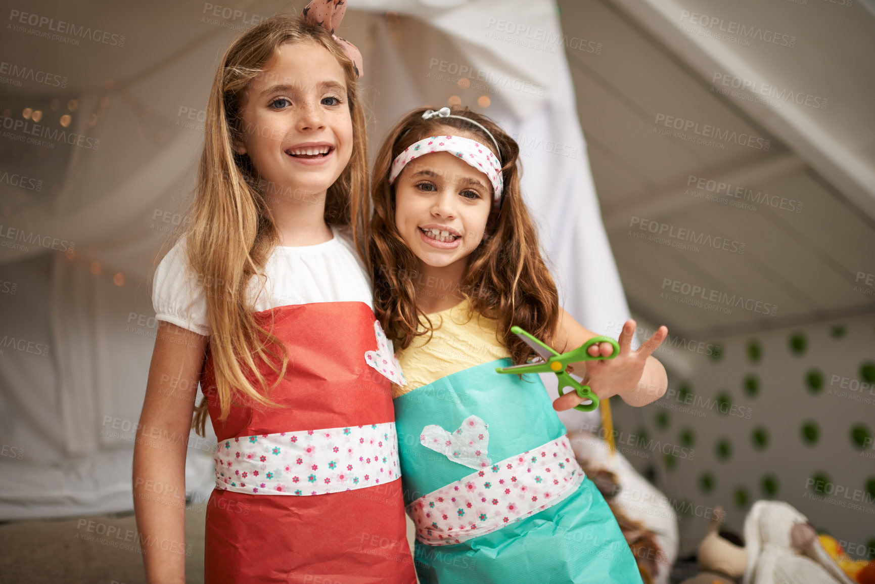 Buy stock photo Style, paper and portrait of children with dress for fun, show or playing together at home. Happy, smile and young girl kids in gift wrap outfit for fashion with bonding in bedroom at house.