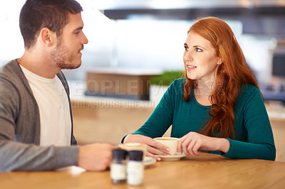 Buy stock photo Restaurant, date and couple with coffee, love and conversation with romance and flirt. Cafe, man and woman with morning tea and bonding together with care and relationship with marriage and trust