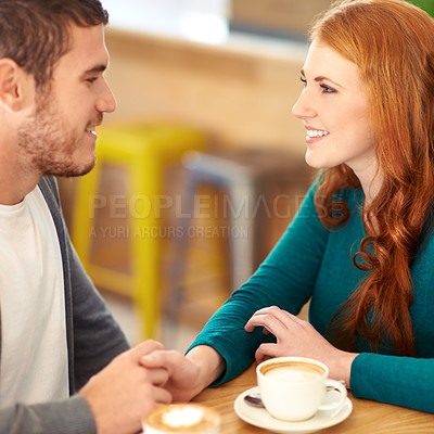 Buy stock photo Restaurant, date and couple with coffee, holding hands and relationship with romance and flirt. Cafe, man and woman with cappuccino or bonding together with care or love with marriage, smile or trust