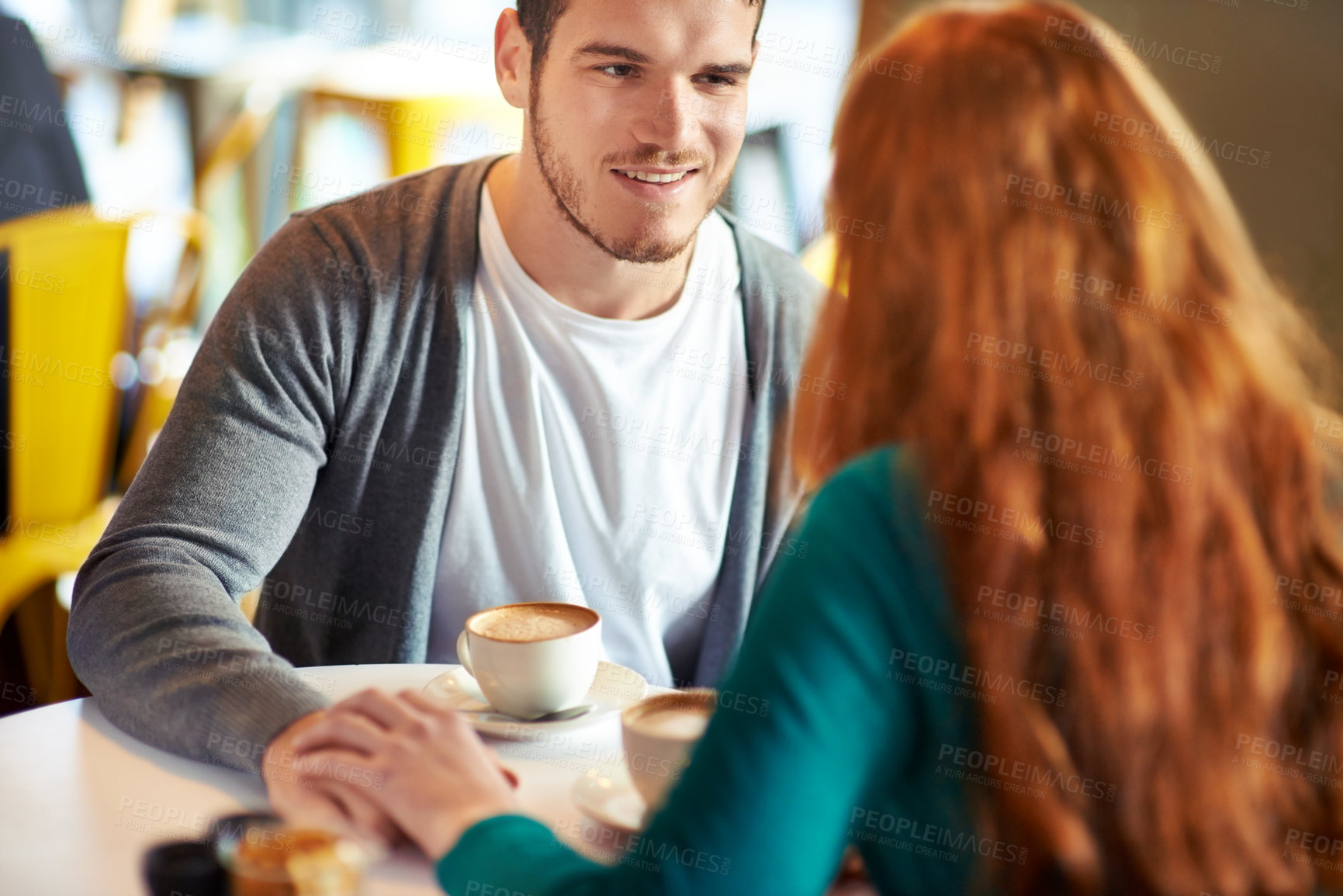 Buy stock photo Couple, man and smile for touch in coffee shop,  love and  support with happiness for peace in marriage. Adult, male person and together  with girl or partner holding hands in cafe, joy and relax