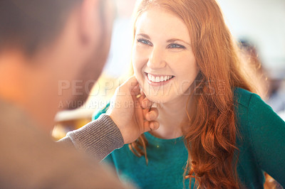 Buy stock photo Cafe, couple and touch on face of woman with happiness, smile and relax in date with man. Adult, female person and girl with guy or partner with hand to caress in coffee shop and joy for marriage