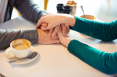 Buy stock photo Holding hands, couple and coffee in cafe with love, romance and affection on anniversary date. Respect, together with care and bonding, loyalty and support in relationship with cappuccino for people
