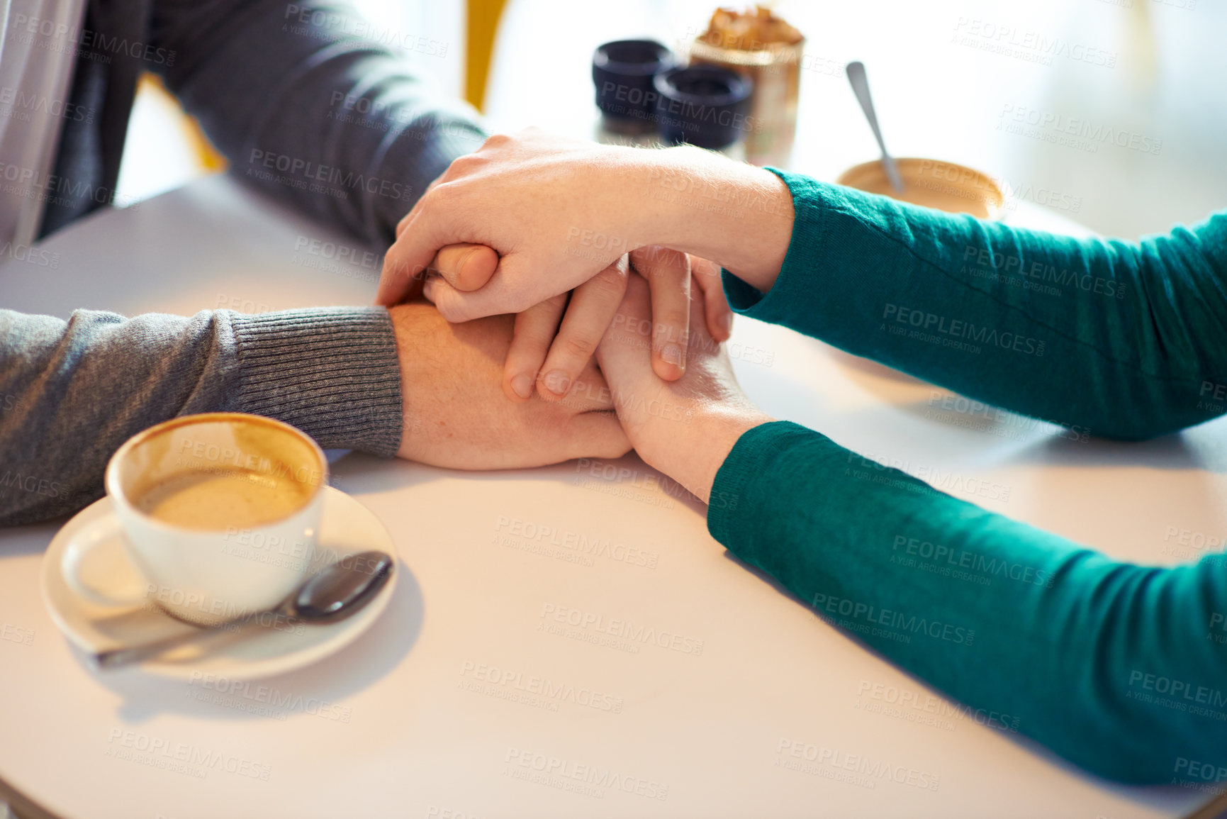 Buy stock photo Holding hands, couple and coffee in cafe with love, romance and affection on anniversary date. Respect, together with care and bonding, loyalty and support in relationship with cappuccino for people