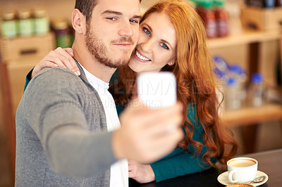 Buy stock photo Couple, coffee and selfie with smartphone in cafe, man and woman together with smile. Happy people, romantic and dating in relationship with affection, mobile and photography for social media post