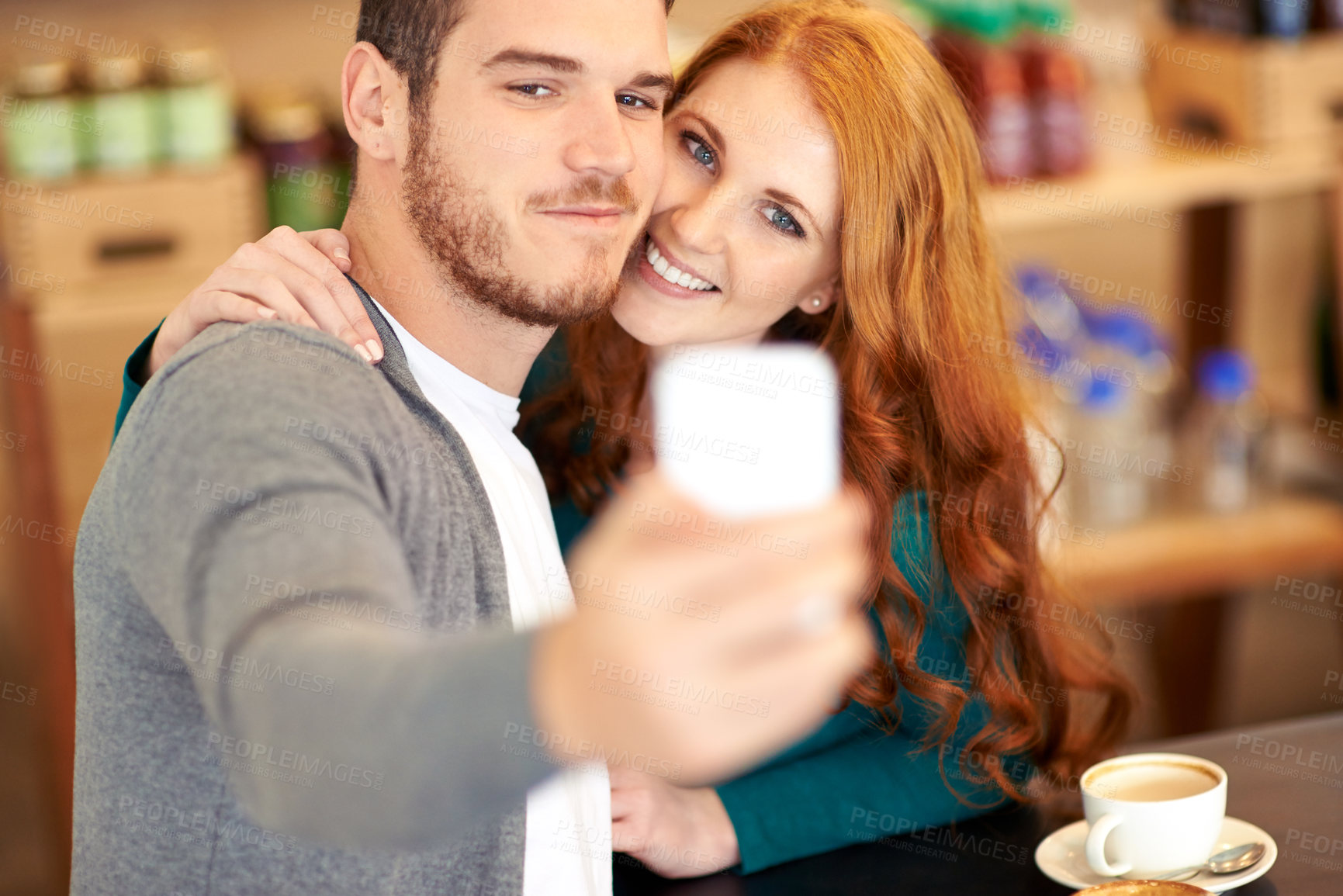 Buy stock photo Couple, coffee and selfie with smartphone in cafe, man and woman together with smile. Happy people, romantic and dating in relationship with affection, mobile and photography for social media post