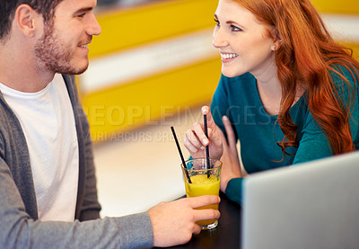 Buy stock photo Cafe, laptop and couple with conversation, date and planning with juice and relationship. Restaurant, computer and man with woman and romance with smile and happiness with discussion or healthy drink