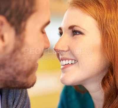 Buy stock photo Couple, eye contact and smile with romantic date together in cafe for support, love and bonding. Partner, relax and face of people for anniversary, valentines day or celebration in restaurant