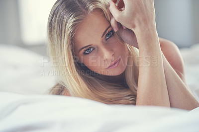 Buy stock photo Portrait, sexy and beauty of woman in bed, lying and relax in home alone. Natural face, bedroom and beautiful female person wake up after rest, serious and comfort on sheets in the morning in Canada.
