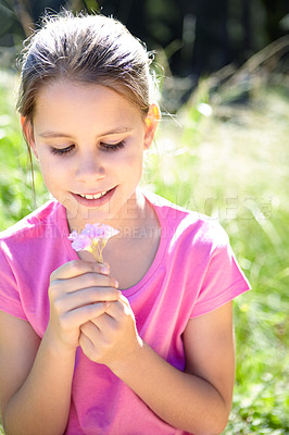 Buy stock photo Smile, kid and girl with flower in nature for summer vacation, development and relax in grass field. Garden, happy and child with plant for sunshine, holiday and adventure in green environment