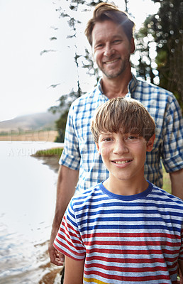 Buy stock photo Man, lake and portrait with son in nature for vacation, summer holiday and happiness in Australia. Dad, kid and smile with bonding for weekend travel, adventure and tourism in forest outdoors
