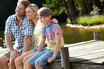 Buy stock photo Nature, dock and parents with son by river for summer vacation, holiday and bonding in forest. Lake, smile and happy family with love for weekend adventure, travel and tourism together in Europe