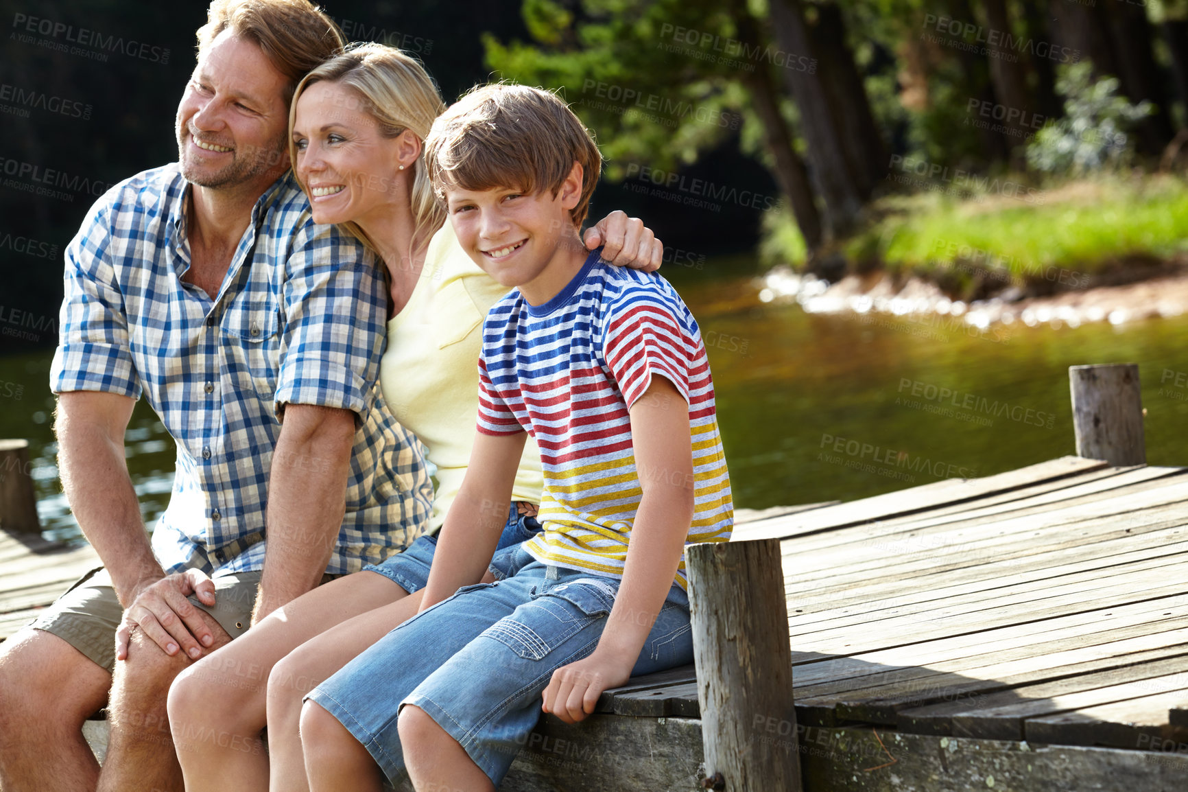 Buy stock photo Nature, dock and parents with son by river for summer vacation, holiday and bonding in forest. Lake, smile and happy family with love for weekend adventure, travel and tourism together in Europe