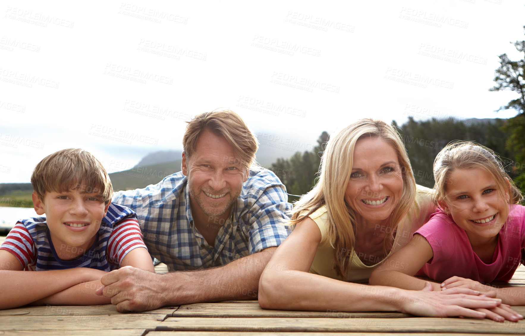 Buy stock photo Smile, dock and portrait of family in nature for bonding, summer holiday and vacation together. Man, woman and kids with happiness for weekend adventure, travel and tourism outdoors in Europe