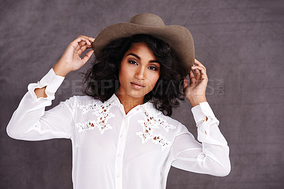 Buy stock photo Portrait, studio and woman with cowboy fashion, confidence  and relax with girl in stetson hat. Rodeo, western style and face Mexican model with cowgirl culture, wild west clothes and grey background