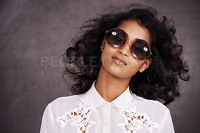 Buy stock photo Studio, boho and fashion for portrait of woman with sunglasses and confidence for Indian girl. Dark background, adult and female person with unique style, relax and aesthetic for proud model