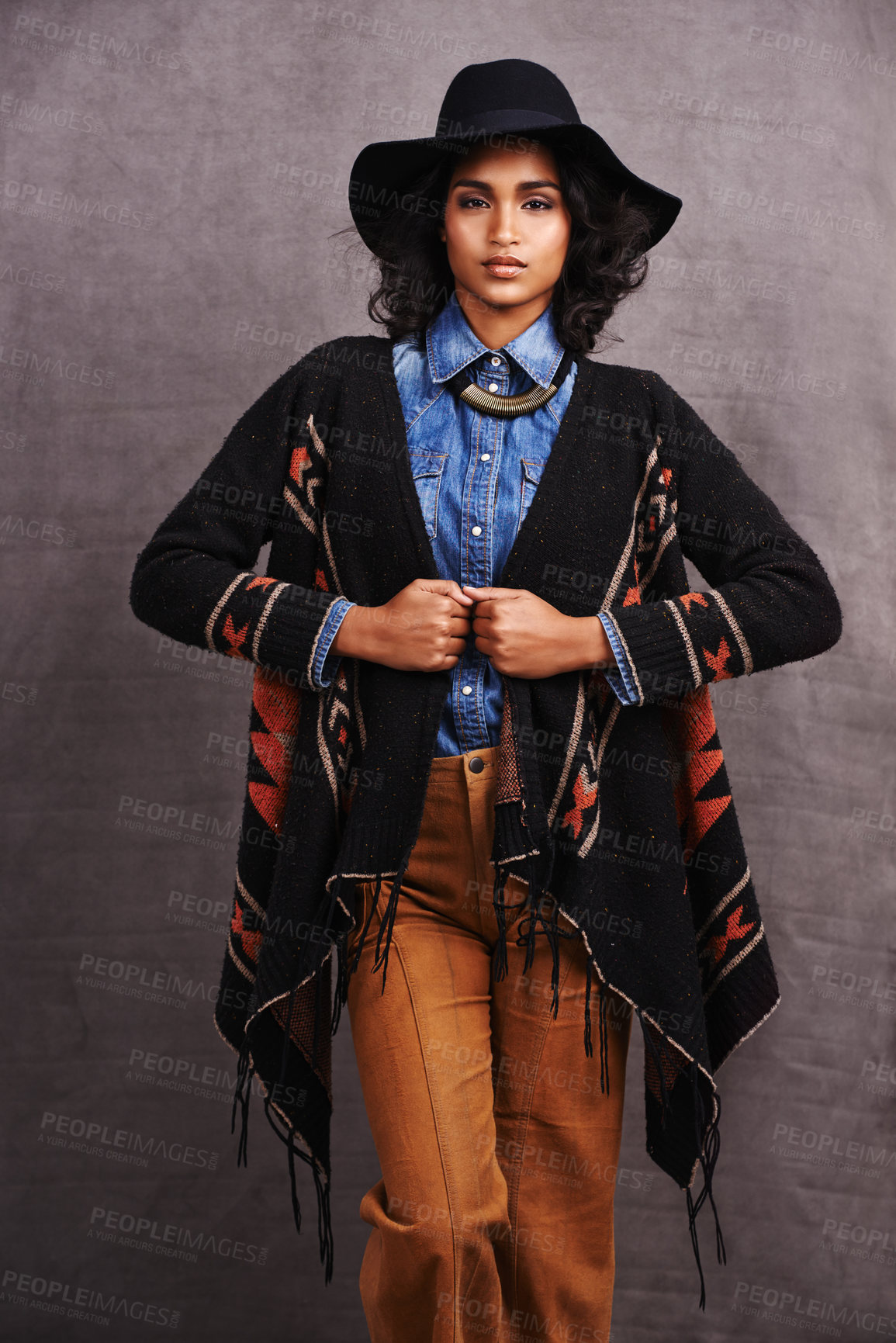 Buy stock photo Fashion, cowgirl or woman with confidence in portrait, studio or cool clothing in culture on grey background. Native American person, unique or stylish model with pride, boho style or western poncho