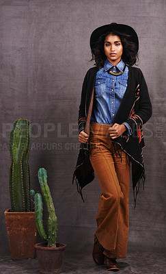Buy stock photo Cactus, fashion or woman in cowgirl, portrait, wild west culture and cool clothes in studio on grey background. Native American person, western lady and stylish model with pride, boho style or plants