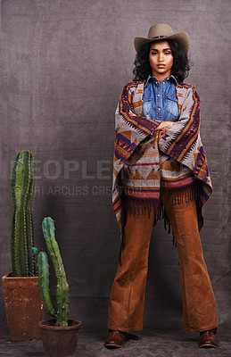 Buy stock photo Cactus, fashion or cowgirl in style, portrait, wild west culture or cool clothes in studio on grey background. Confident person, western woman or stylish model with pride, boho outfit or plants