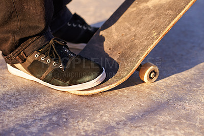 Buy stock photo Closeup, skateboard and person with sneakers, skill and training with technique or fitness. Skater, practice or athlete with energy, sunshine or performance with weekend break, shoes or skating style