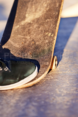 Buy stock photo Closeup, shoes and skateboard with sunshine, person and fitness with performance and talent with skill. Skater, outdoor and summer with sneakers and energy with cardio and balance with recreation