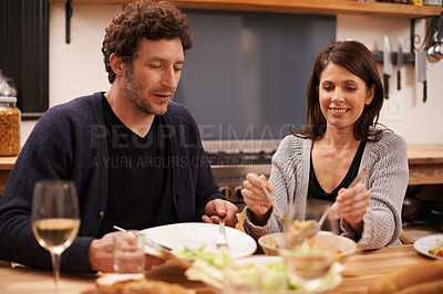 Buy stock photo Couple, food and table for meal in home, conversation and healthy supper in apartment for anniversary. Happy people, bonding and eating together on weekend, relax and speaking on romantic dinner date