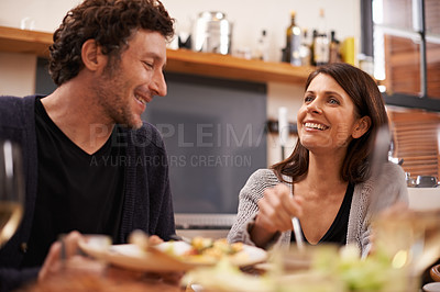 Buy stock photo Couple, food and table for love in home, conversation and healthy meal in apartment for anniversary. Happy people, bonding and eating together on weekend, relax and speaking on romantic dinner date