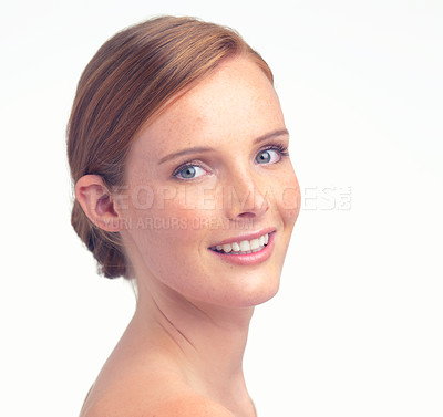 Buy stock photo Portrait, natural beauty and smile of woman for skincare, glow or health in studio isolated on a white background mockup space. Face, happy and ginger model with freckles, cosmetics and dermatology