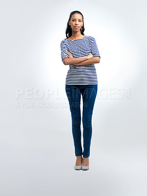Buy stock photo Fashion, crossed arms and portrait of woman in studio with casual, trendy and stylish outfit. Confident, pride and full body of female person with jeans and tshirt for cool style by white background.