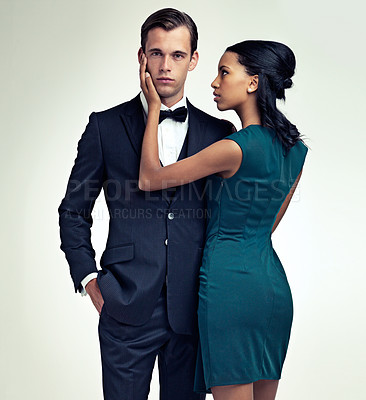 Buy stock photo Portrait, man and woman in elegant fashion in studio and confidence in vintage style in mock up. Face, pride or young for interracial couple in formal clothes and touch for care by white background