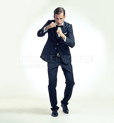 Buy stock photo Business, man and portrait in studio to fight with fists, frustrated, annoyed and aggression or motivation for corporate power. Person, isolated and white background with determination for success