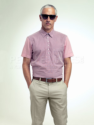 Buy stock photo Confident, older or man in business, fashion or stylish outfit and apparel on white background. Businessman, hands in pocket or eyewear as smart, casual or unique leisure wear to relax on getaway
