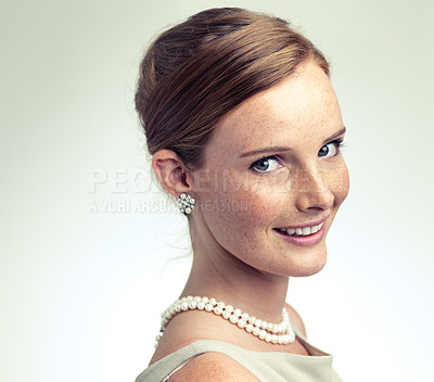 Buy stock photo Portrait, fashion and beauty of happy woman in studio isolated on a gray background mockup space. Face, freckles and skin of young person in vintage clothes for style with pearl necklace in Ireland