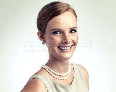 Buy stock photo Portrait, fashion and happy woman in pearl necklace in studio isolated on a gray background mockup. Face, freckles and skin of young person in vintage clothes for style, elegance or beauty in Ireland